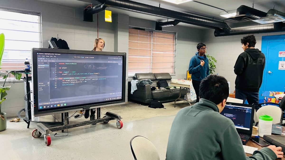 Game code shown on a classroom smart board