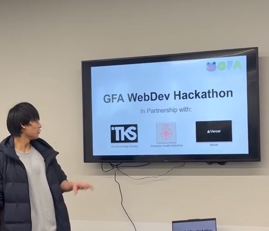 A GFA team member presenting the WebDev Hackathon and its partners: TKS, Compass Youth Collective and Vercel